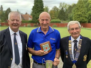 Captain Roland Saich received the trophy from League Secretary Doug Stephenson and President David Atterbury. - North West Essex Champions